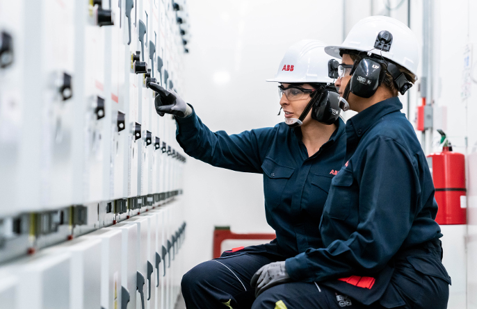 Two ABB employees at work