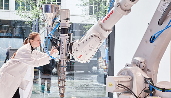 ABB employee and a robot (photo)